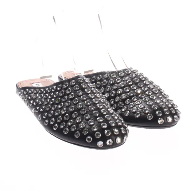 Mules, in Schwarz, Alaia